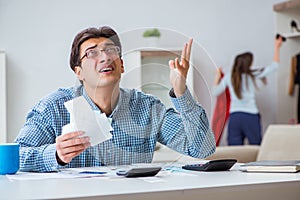 The young couple looking at family finance papers