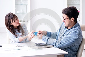 The young couple looking at family finance papers