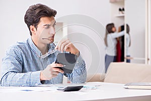 The young couple looking at family finance papers