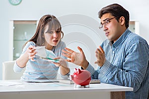 The young couple looking at family finance papers