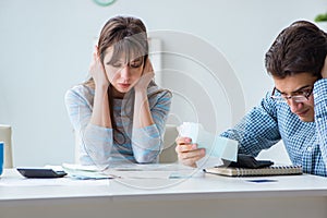 The young couple looking at family finance papers