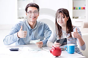 The young couple looking at family finance papers