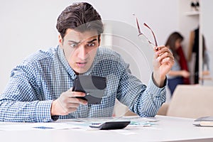 The young couple looking at family finance papers