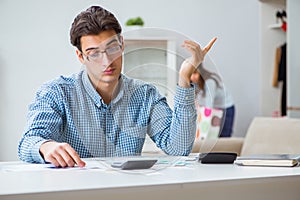 The young couple looking at family finance papers