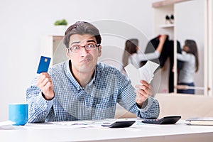 The young couple looking at family finance papers