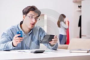 The young couple looking at family finance papers