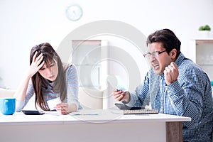 The young couple looking at family finance papers