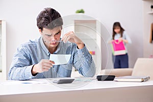 The young couple looking at family finance papers