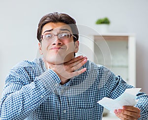 Young couple looking at family finance papers