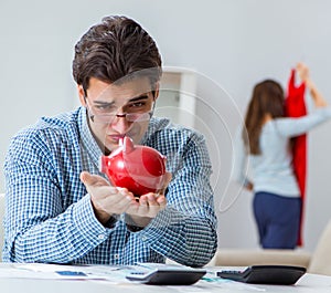 Young couple looking at family finance papers