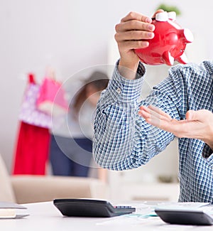 Young couple looking at family finance papers