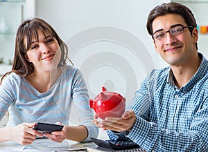 Young couple looking at family finance papers