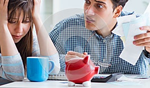 Young couple looking at family finance papers