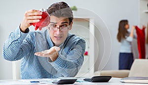 Young couple looking at family finance papers