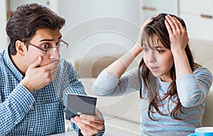 Young couple looking at family finance papers