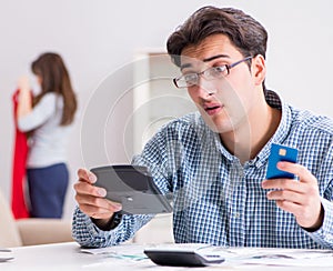 Young couple looking at family finance papers