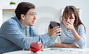 Young couple looking at family finance papers