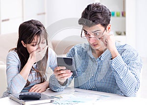 The young couple looking at family finance papers