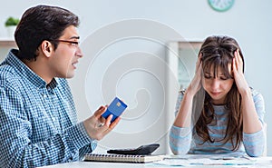 Young couple looking at family finance papers