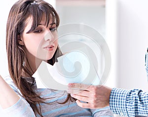 Young couple looking at family finance papers