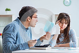 Young couple looking at family finance papers