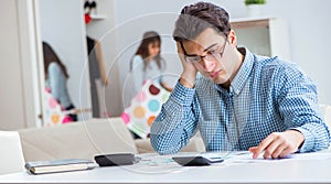 Young couple looking at family finance papers