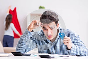 Young couple looking at family finance papers