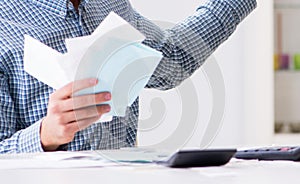 Young couple looking at family finance papers