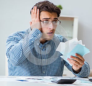 The young couple looking at family finance papers