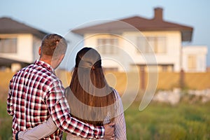 Young couple is looking at house