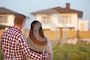 Young couple is looking at house