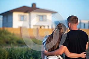 Young couple is looking at house