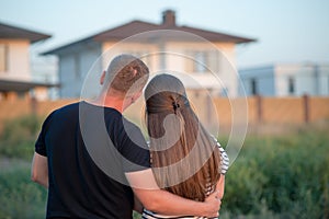 Young couple is looking at house