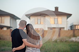 Young couple is looking at house