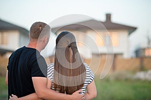 Young couple is looking at house