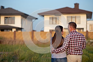 Young couple is looking at house