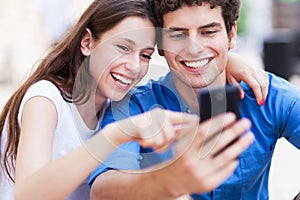 Young couple looking at mobile phone