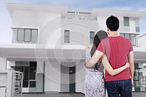 Young couple looking at new home