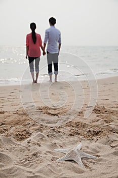 Young Couple Looking Out at the Sea