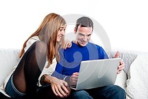 Young couple looking at something on a computer