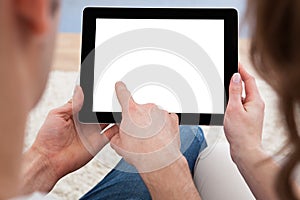 Young couple looking at a tablet together