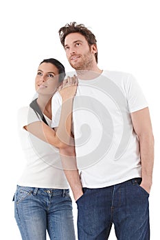 Young couple looking to distance upwards smiling