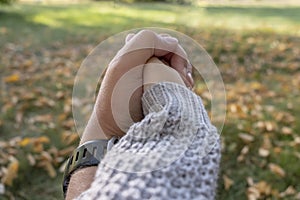 Young couple in love in the autumn park holding hands. Family concept