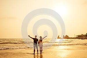 Young couple in love on the beach February 14, St. Valentine`s Day sunset Goa India vacation trip .travel new year in a