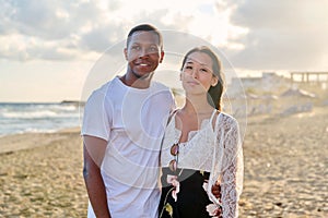 Young couple in love on the beach together.