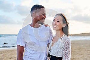 Young couple in love on the beach together.