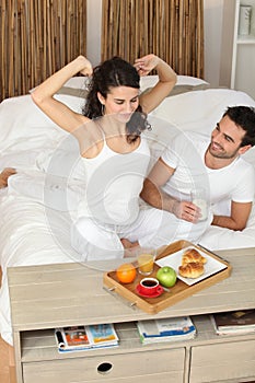 Young couple in love eating breakfast