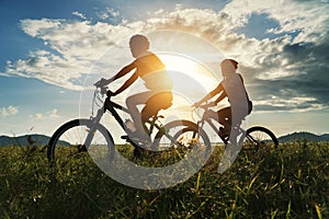 Young Couple in love fun and happy riding mountain bike after covid-19 coronavirus outbreak. End of the coronavirus outbreak.