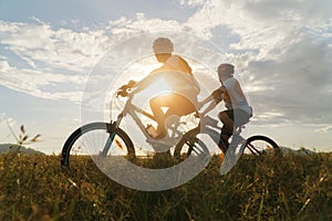 Young Couple in love fun and happy riding mountain bike after covid-19 coronavirus outbreak. End of the coronavirus outbreak.