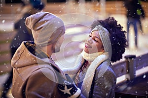 A young couple in love having romantic moments at ice rink. Skating, closeness, love, together